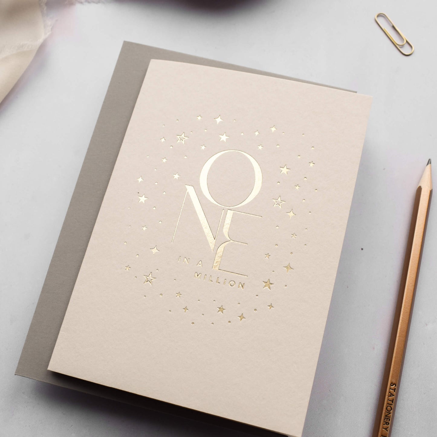 One In A Million Card in Gold Foil