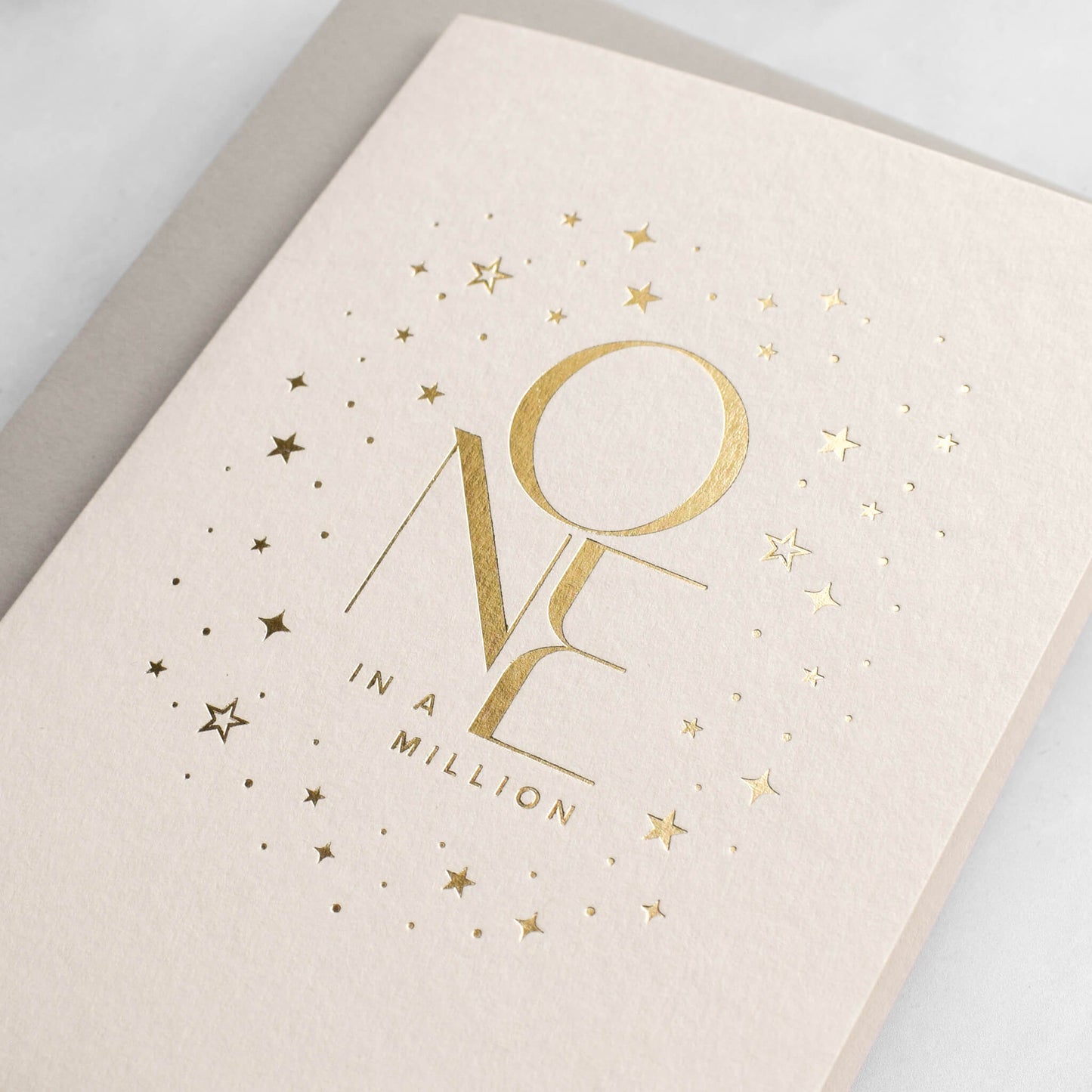 One In A Million Card in Gold Foil